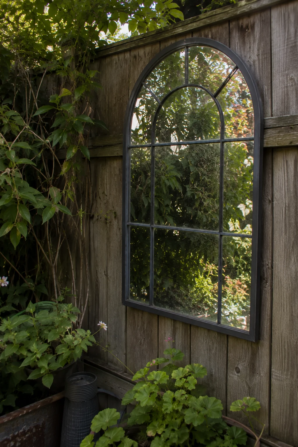 outdoor mirror reflective accent small garden idea